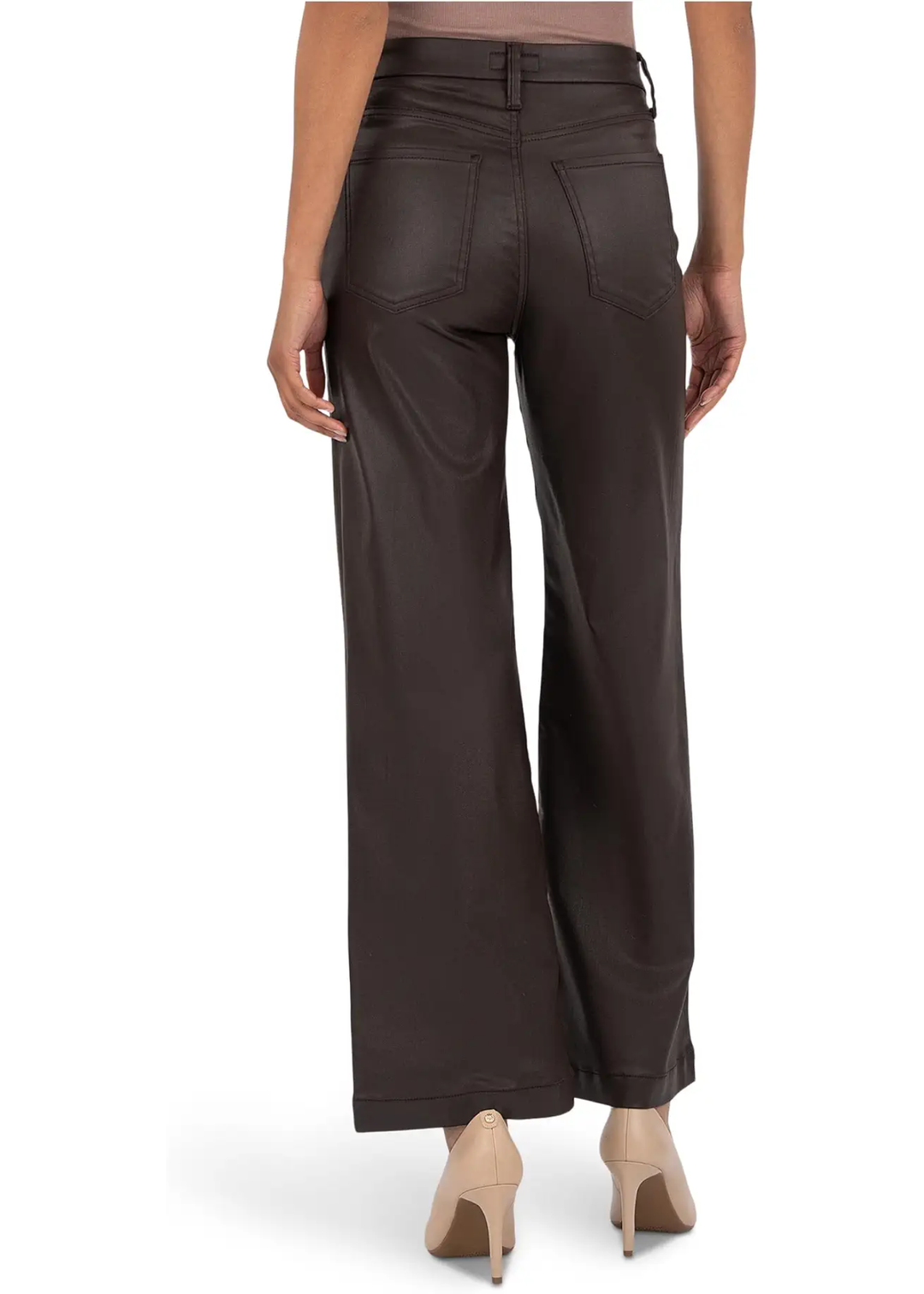 Woman wearing chocolate colored wide leg jeans and turned around.