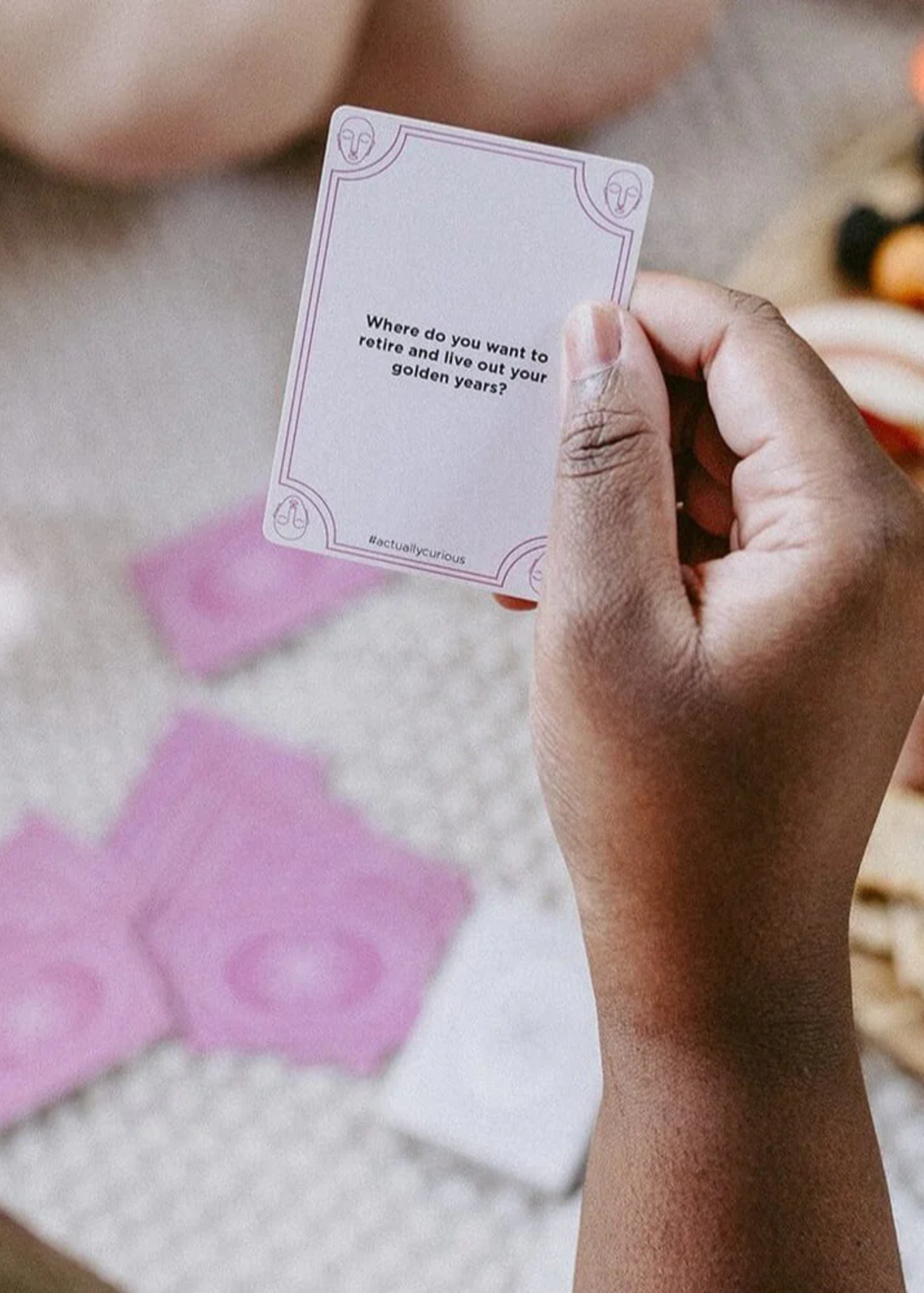 Person holding a card with a question on it
