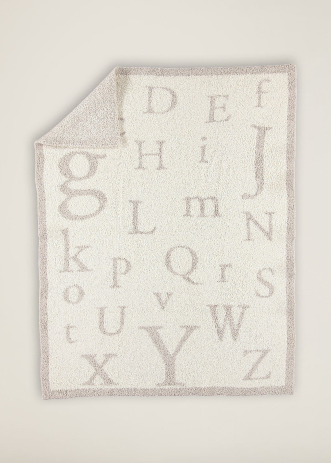 Cream and brown blanket with an ABC pattern