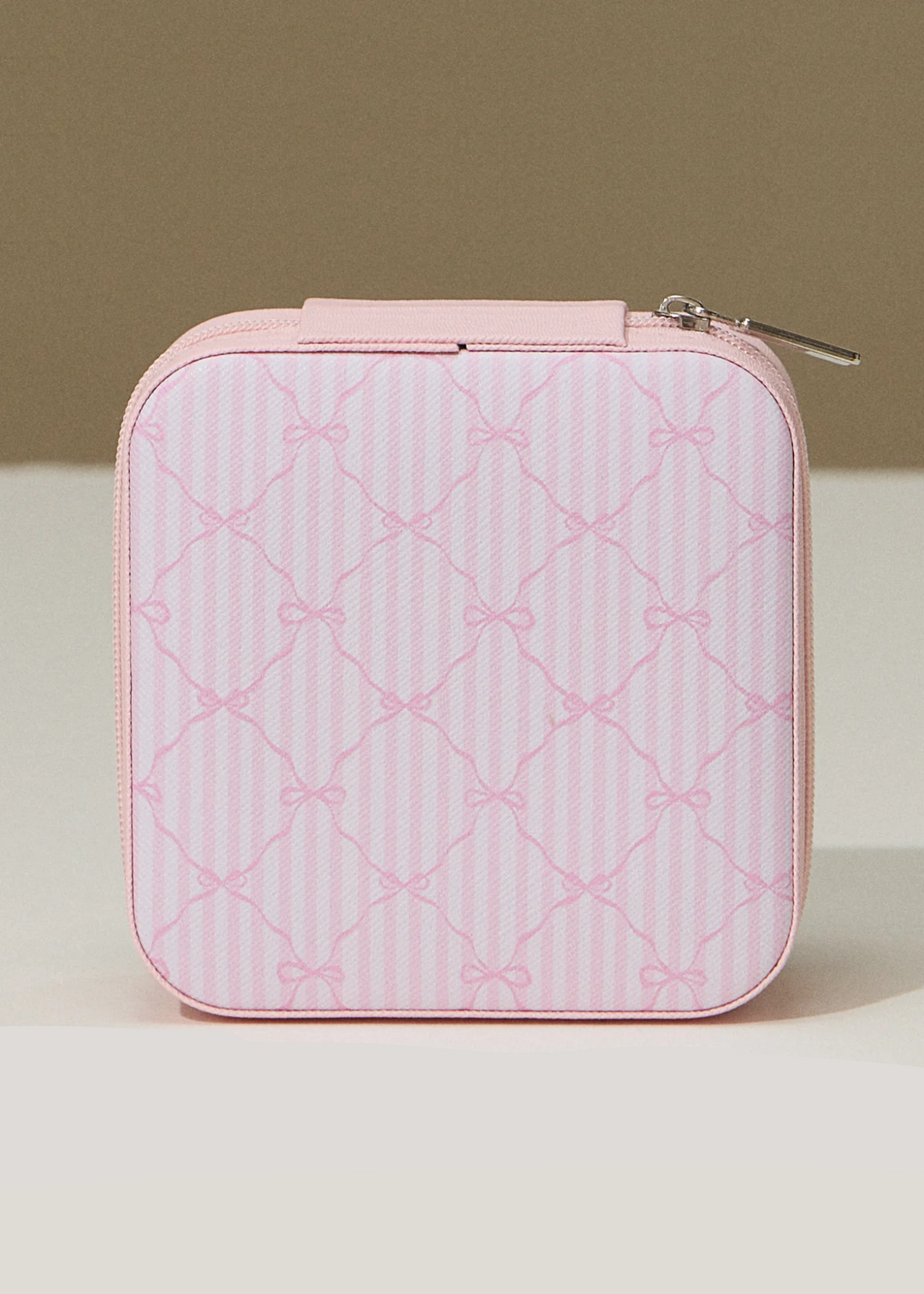 Pink striped travel jewelry box with a pink bow pattern