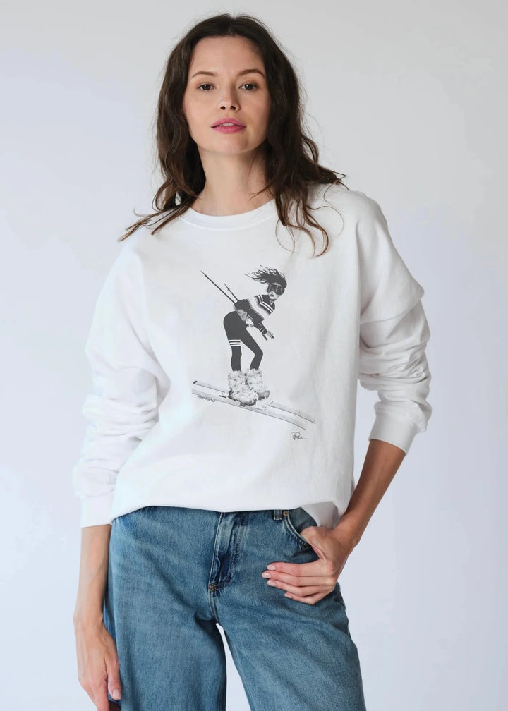 White crew neck sweatshirt with sporty chic retro skier graphic on chest