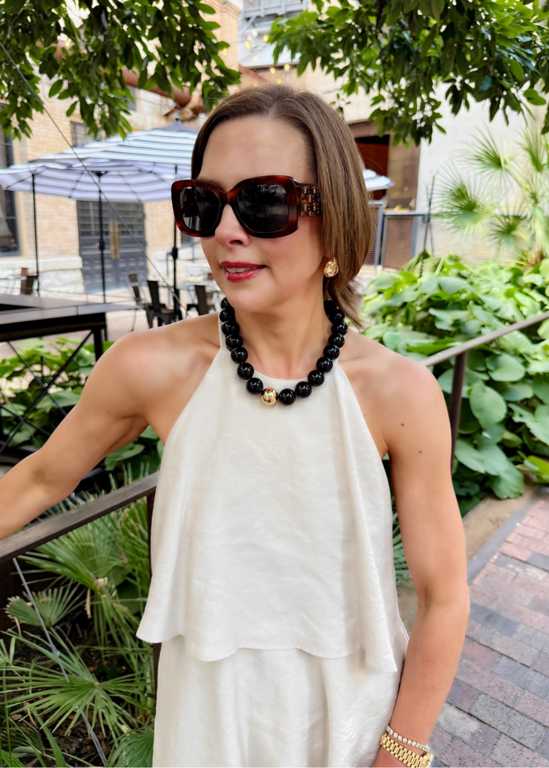 Black beaded necklace with a gold center bead