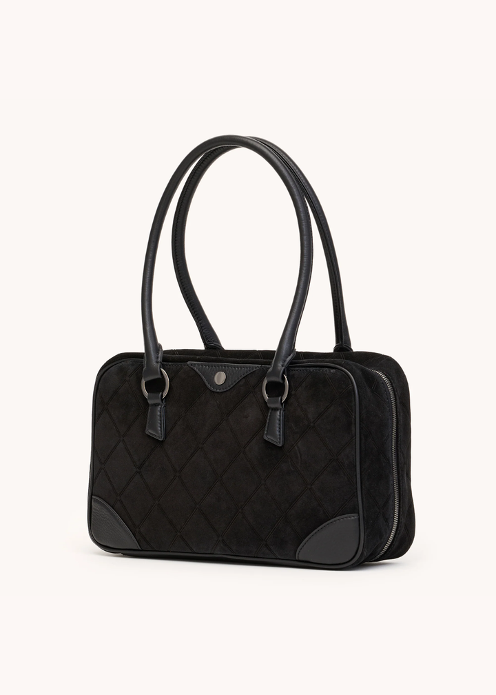 Black suede purse on a white background