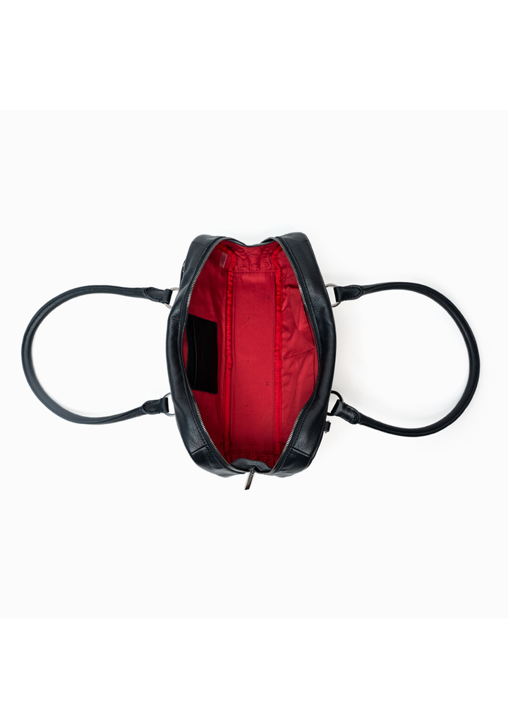 Black leather handbag with red interior lining on a white background