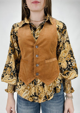 women's camel color corduroy button front vest with faux pocket details and an adjustable back buckle