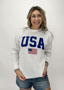 white corded crew neck with USA block letters and small american flag on chest
