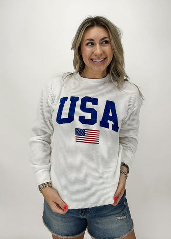 white corded crew neck with USA block letters and small american flag on chest