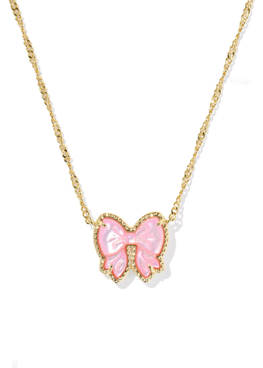 Women's gold necklace with a bow shaped pendant and a pink center stone