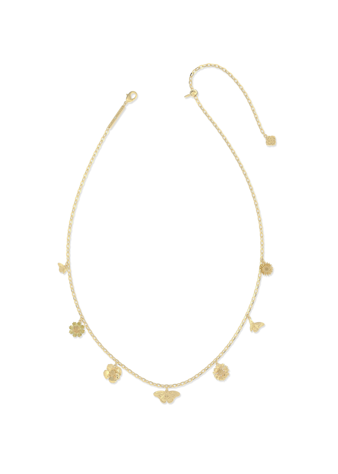 Gold charm necklace on a white background