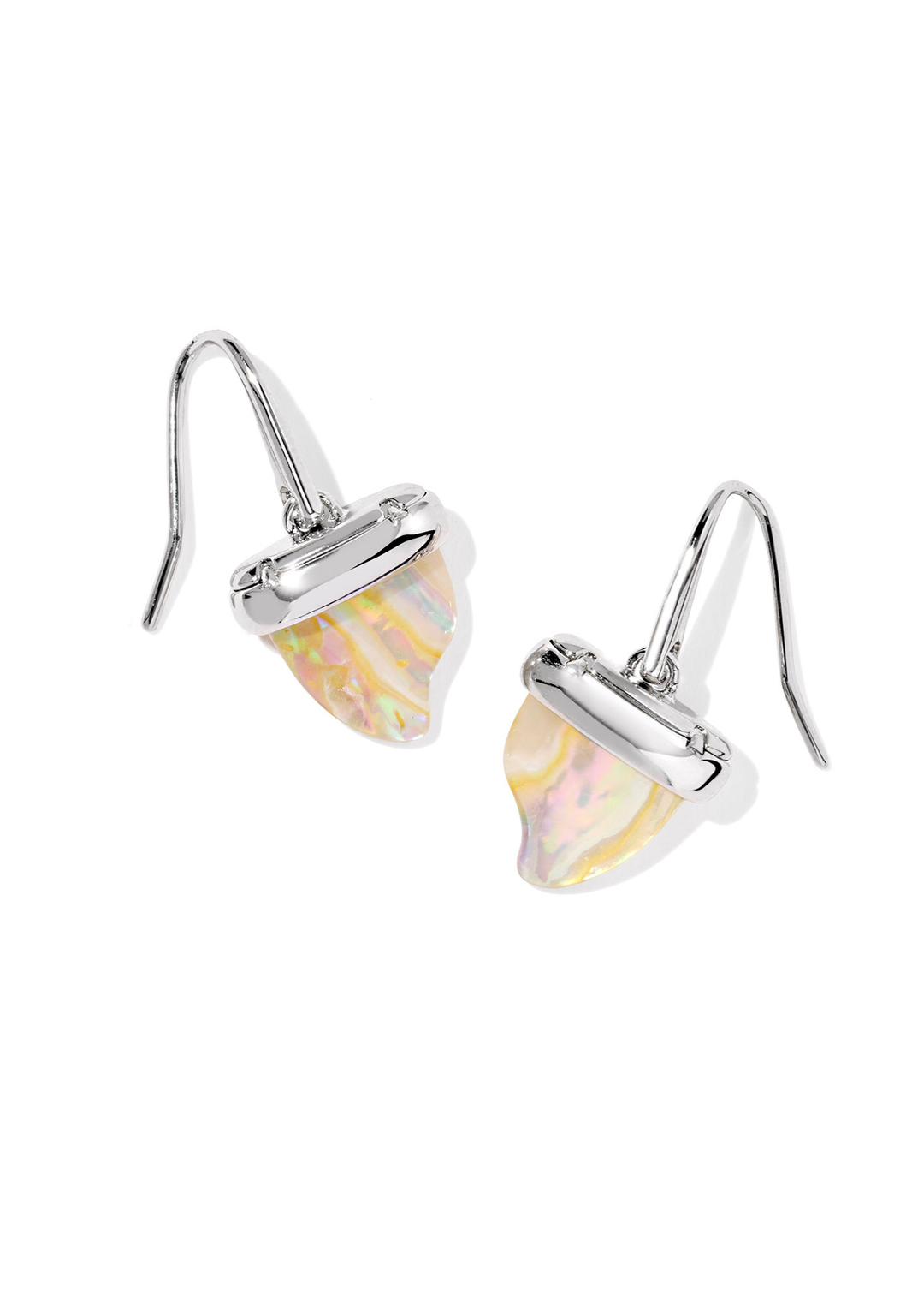 Silver drop earrings with a gold shark tooth shaped stone on a white background