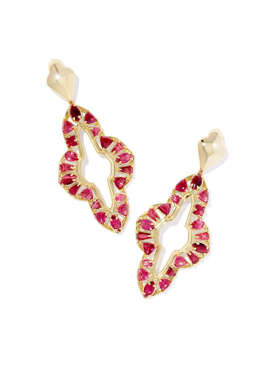 Large gold drop earrings with red stones on a white background