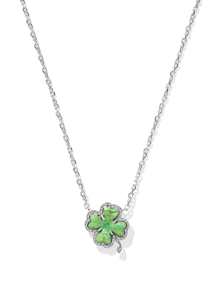 Silver necklace with a green clover pendant on a white background