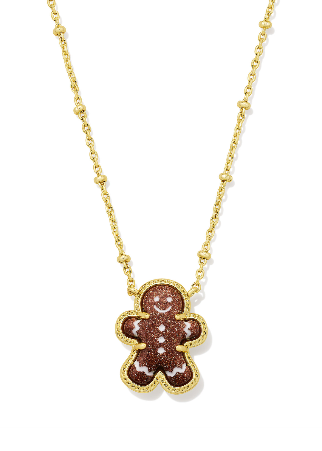 Gold necklace with a brown sparkly gingerbread pendant on a white background
