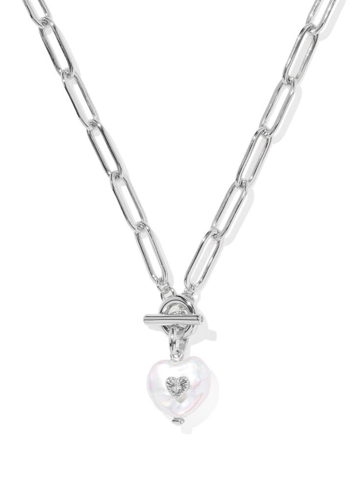 Silver chain necklace with a heart shaped pearl pendant on a white background