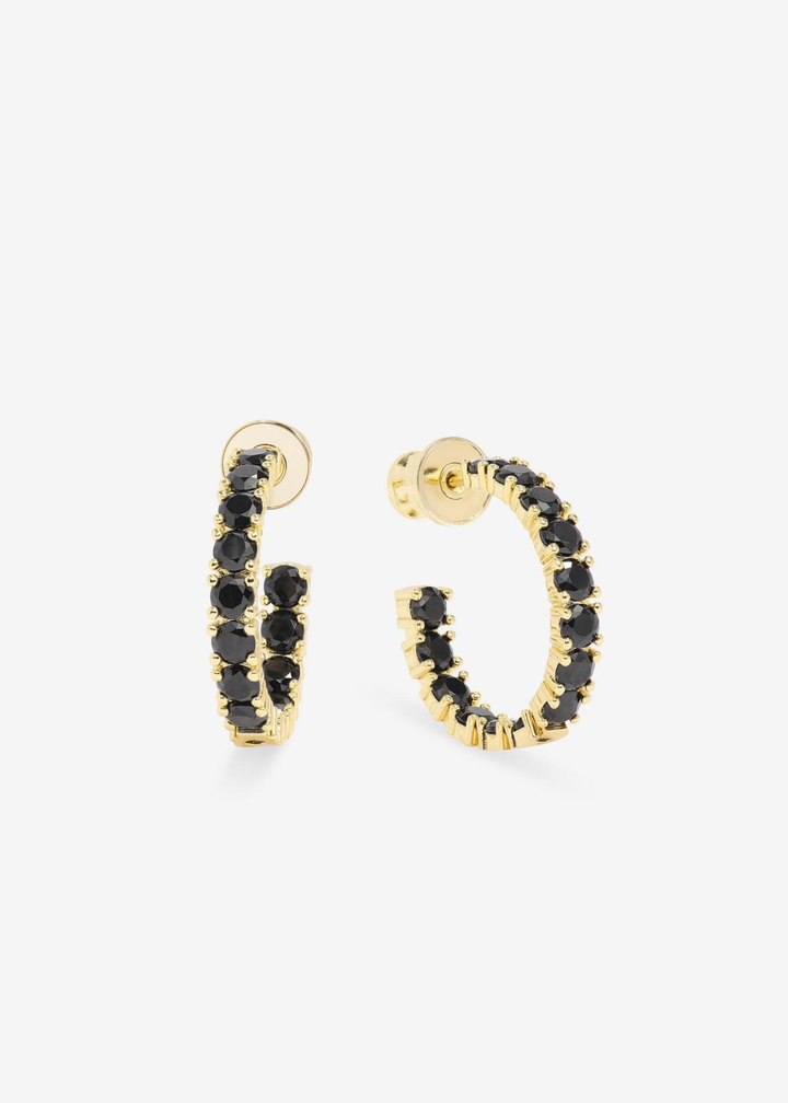 Gold framed black simulated diamond hoop earrings against a white background