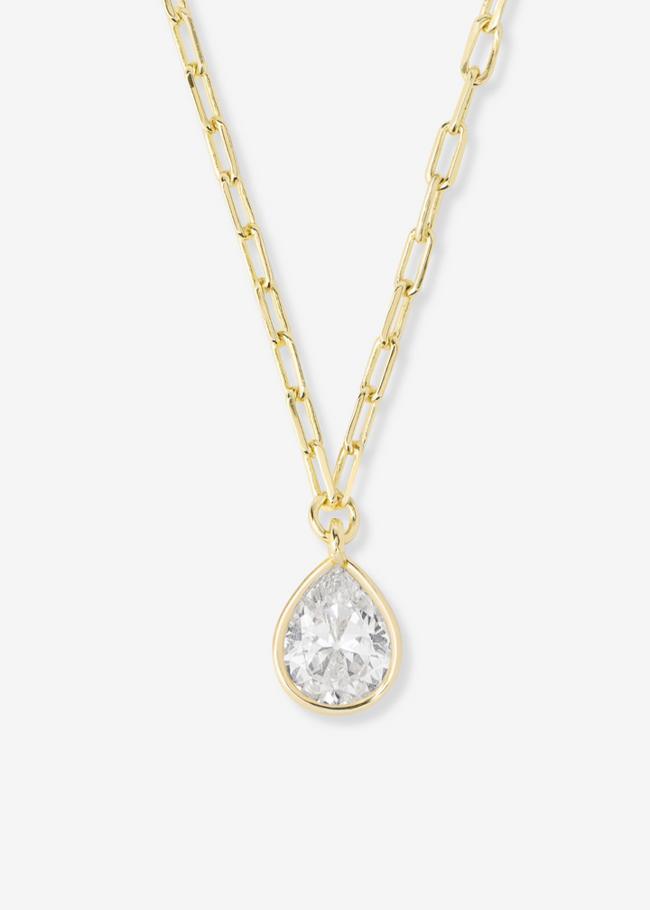 Women's gold framed diamond pendant necklace with a gold chain