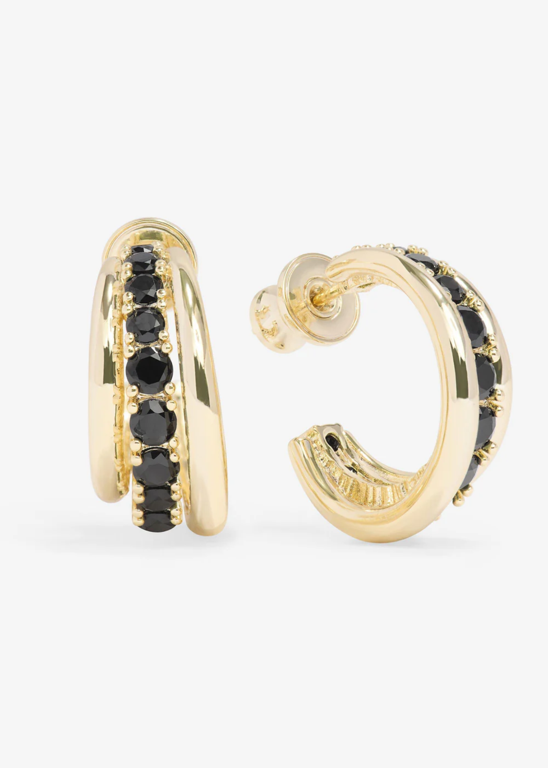 Smooth gold hoop earrings with a row of black simulated diamonds in the middle against a white background