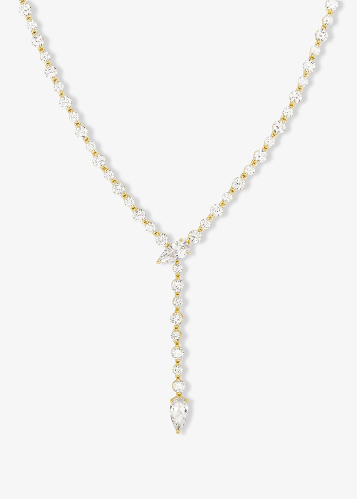 Gold simulated diamond tennis lariat necklace on a white background