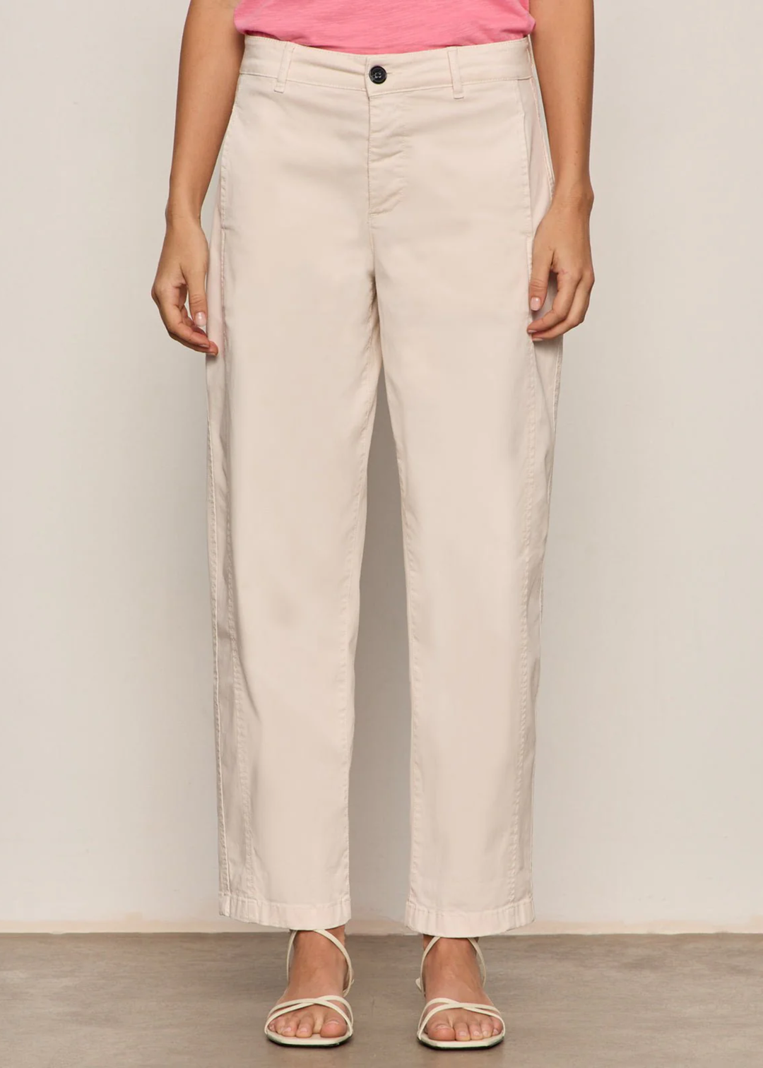 Woman wearing light pink jeans