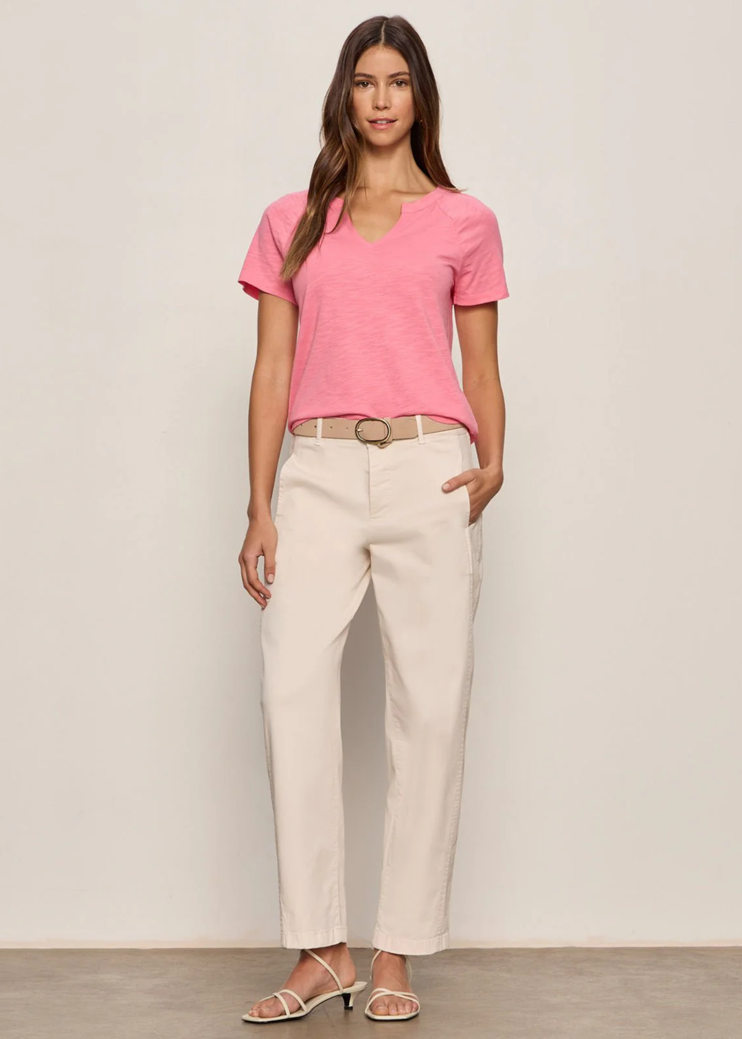 Woman wearing light pink jeans