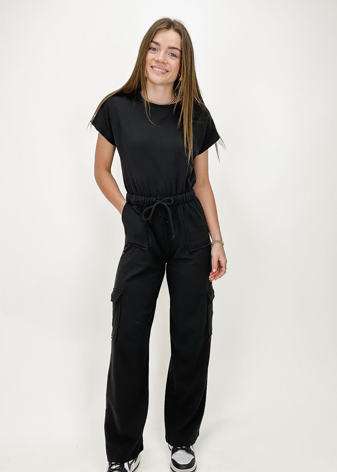 black short sleeve wide leg cargo jumpsuit with drawstring waist