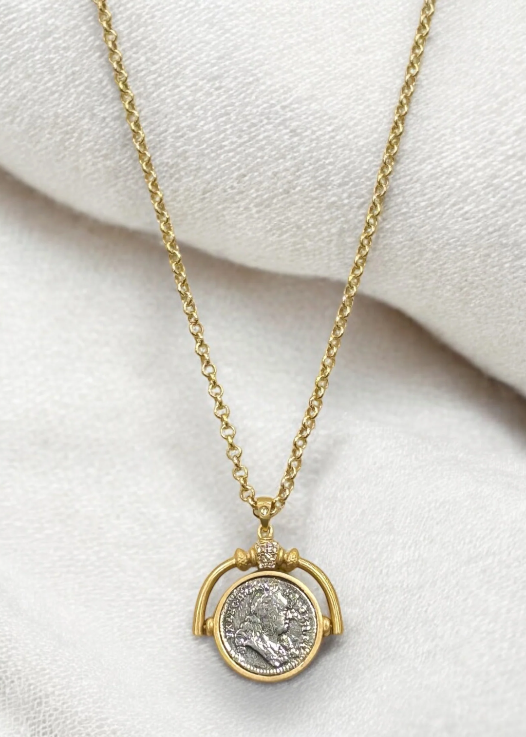 Gold necklace with a spinner and vintage coin pendant