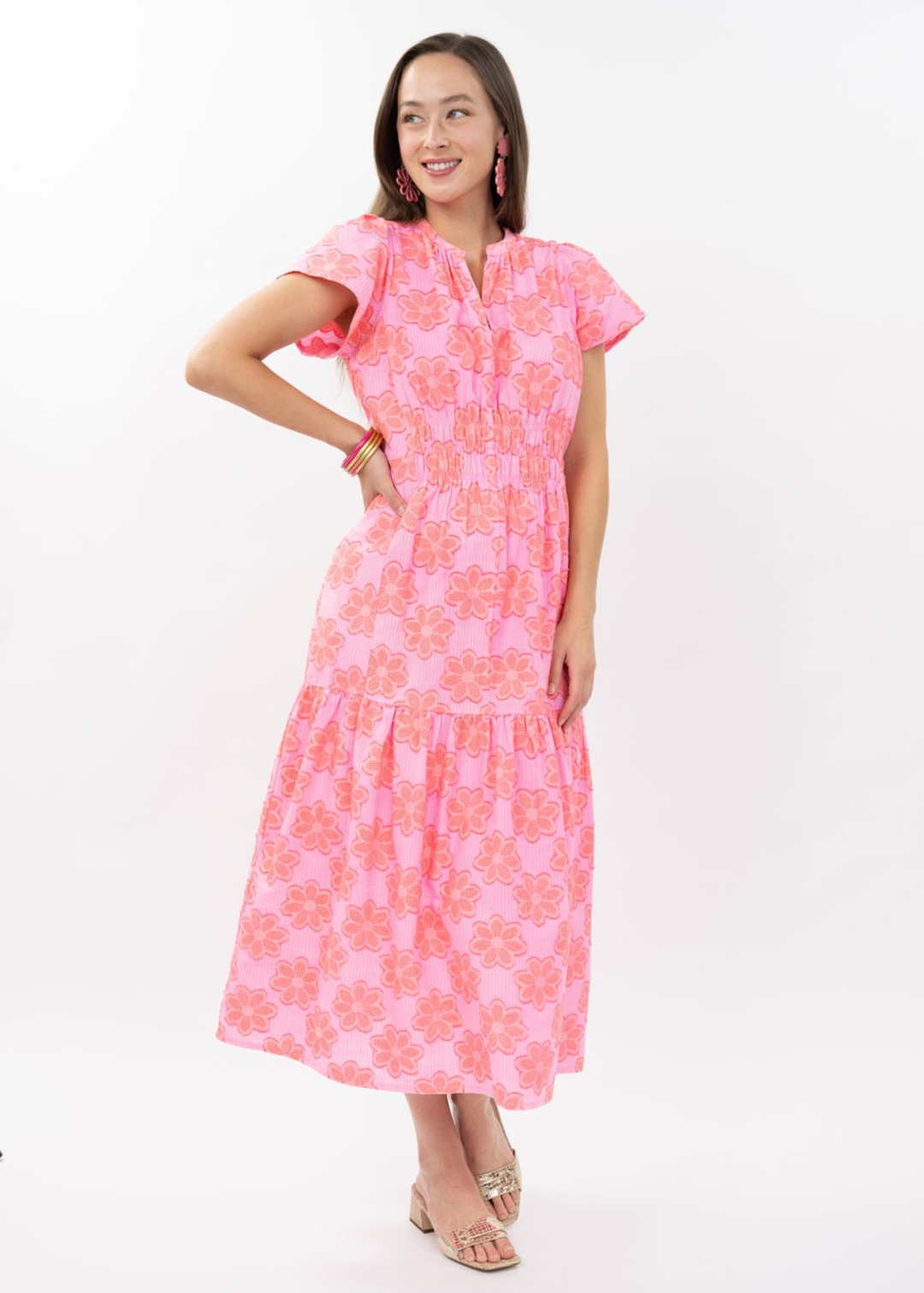 Woman wearing a pink floral midi dress