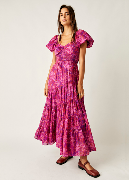 magenta floral print maxi dress with ruched neckline, short puff sleeves, and asymmetrical tiered skirt 