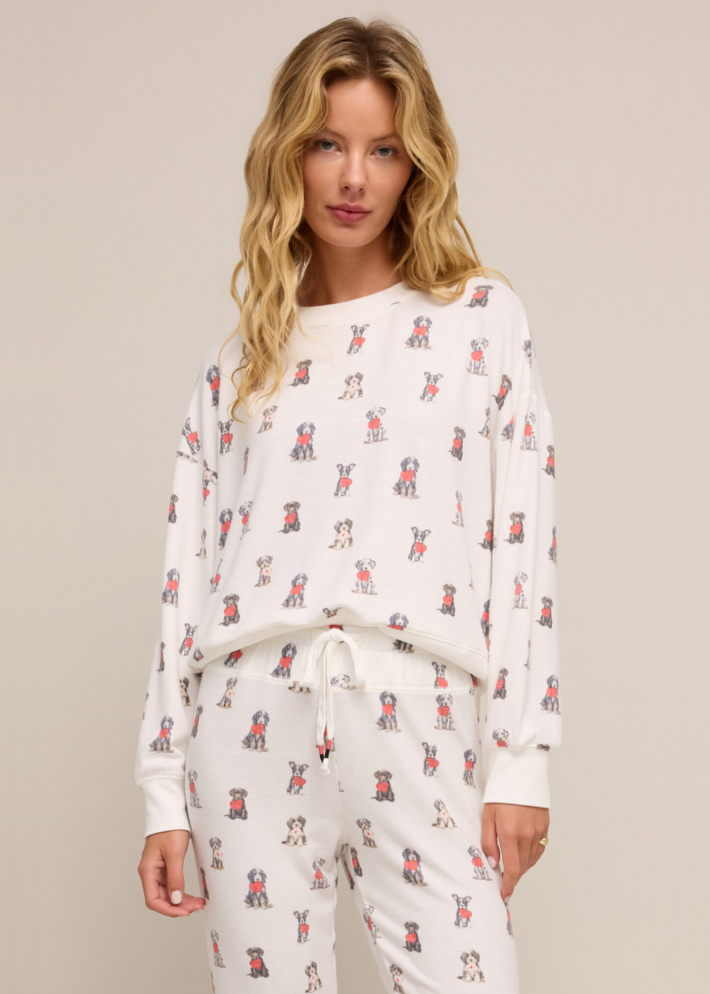 white long sleeve crew neck pajama top with puppies holding hearts all over