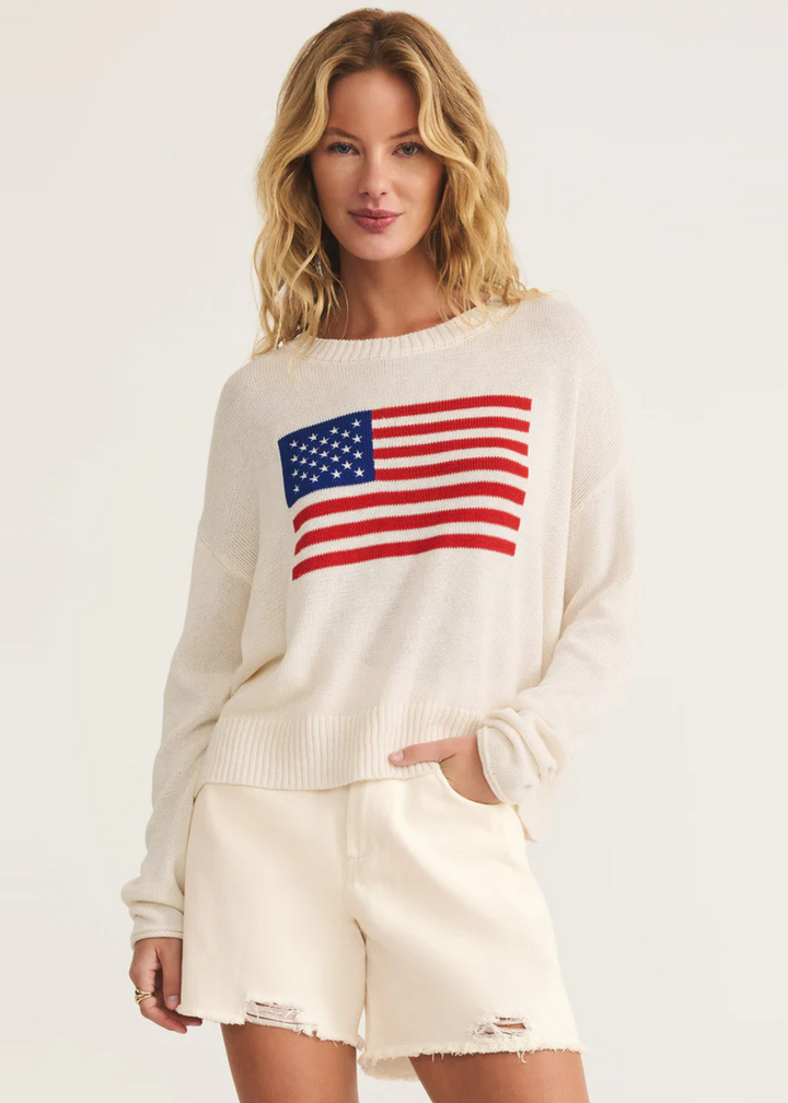 Women's cream sweater with american flag knit graphic on chest