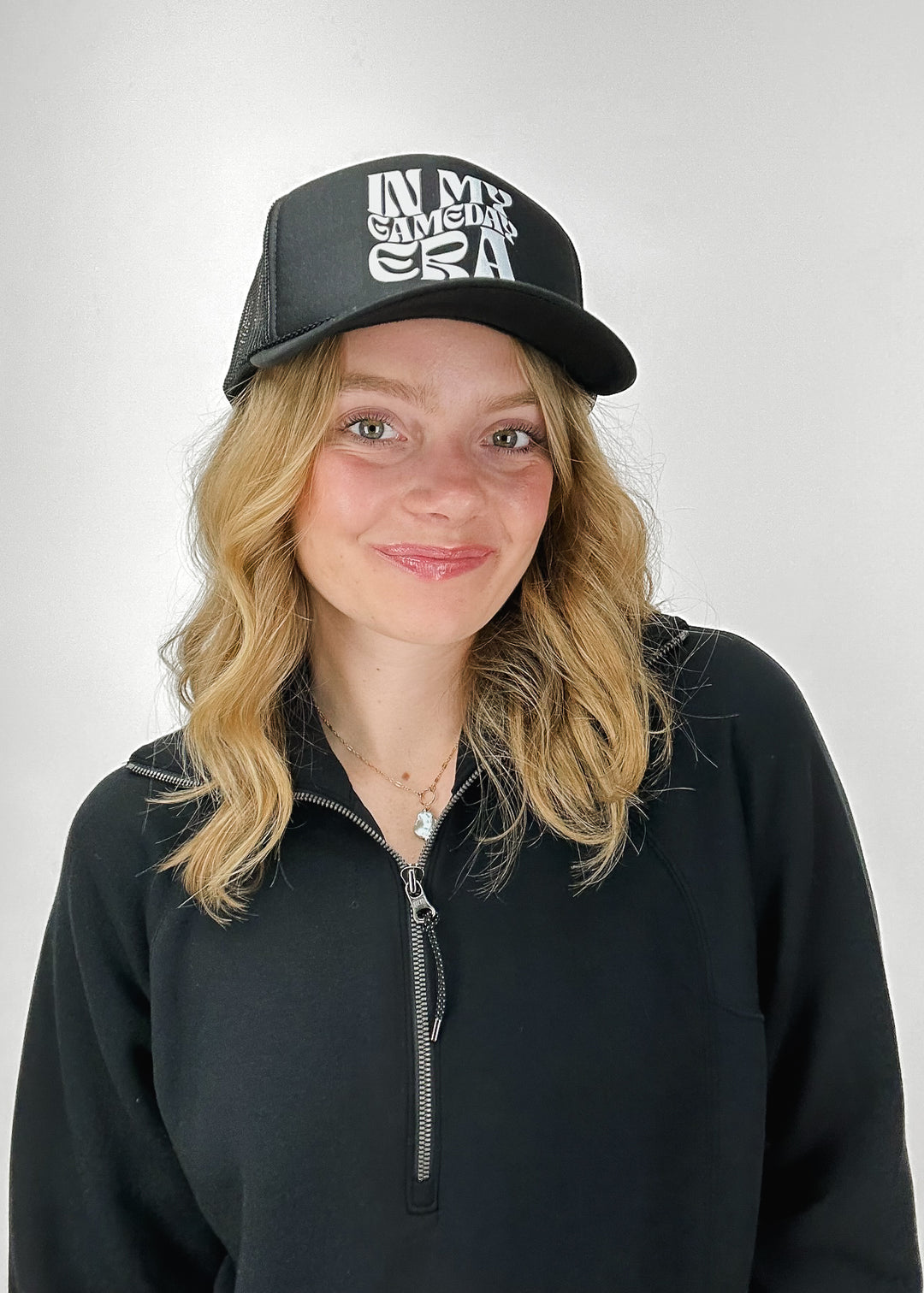 black trucker hat with "In My Gameday Era" on front