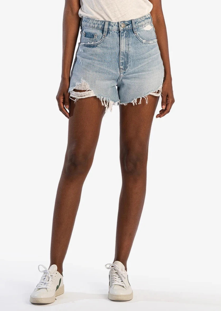 vintage wash distressed denim shorts with raw hem and tears across hem