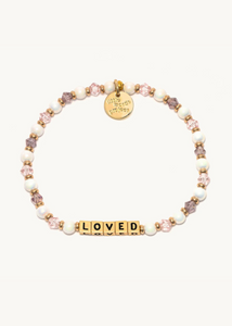 pink crystal and faux pearl bead bracelet with gold square beads that read "loved"