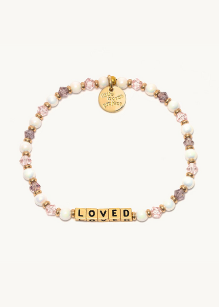 pink crystal and faux pearl bead bracelet with gold square beads that read "loved"