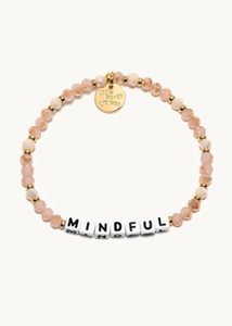 pink crystal bead bracelet with gold spacer accents and square beads that read "mindful"