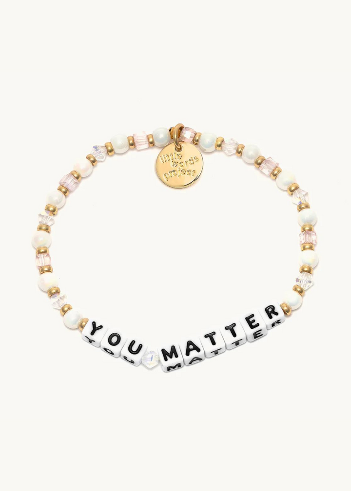 crystal bead bracelet with gold accents and square beads that read "you matter: