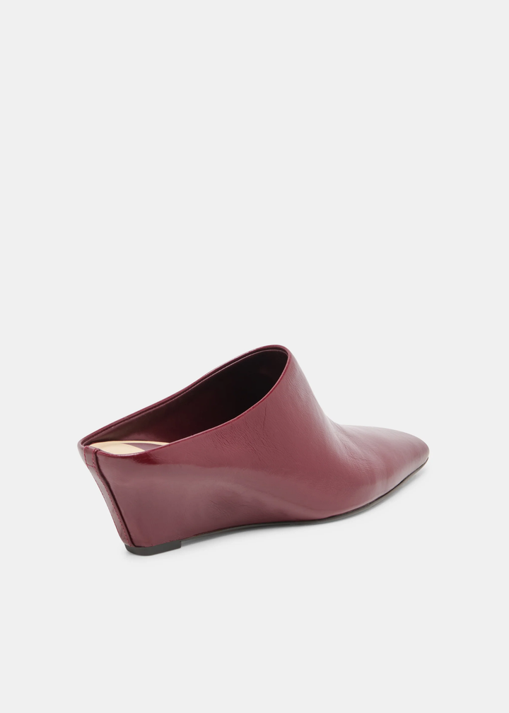 A single women's pointed-toe mule bootie in smooth burgundy leather, shown from a side-rear angle on a light gray background.
