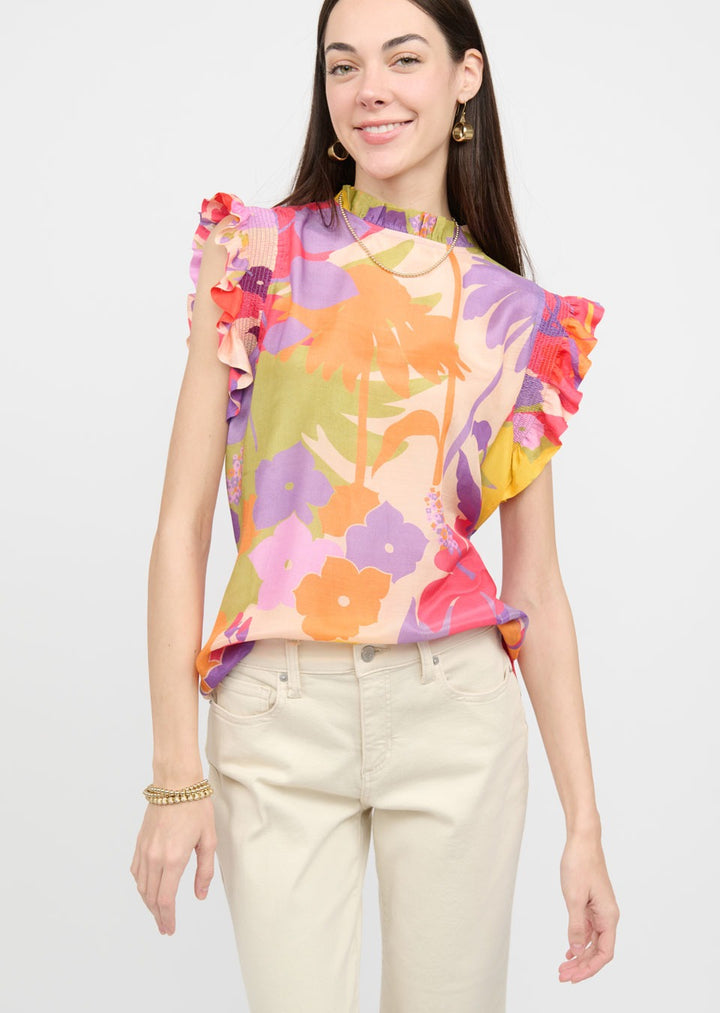 peach, green, purple, pink, and yellow floral print top with ruffle collar and short ruffle sleeves