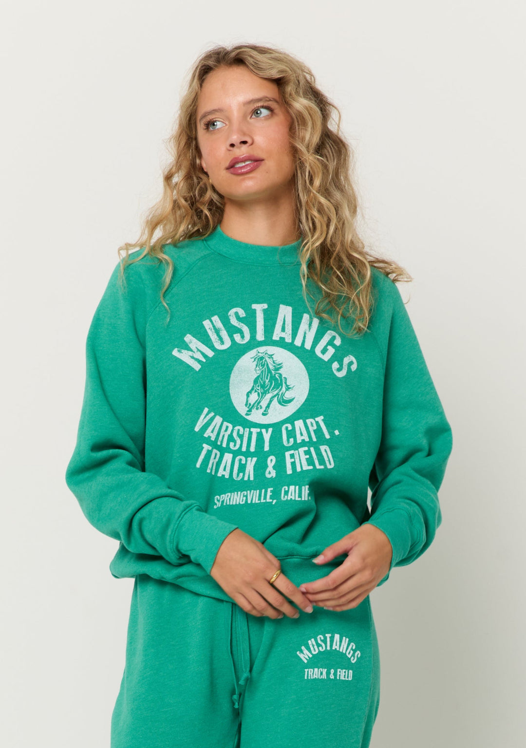 teal heather crew neck with "Mustangs varsity capt. track & field Springville, calif." white graphic on chest 