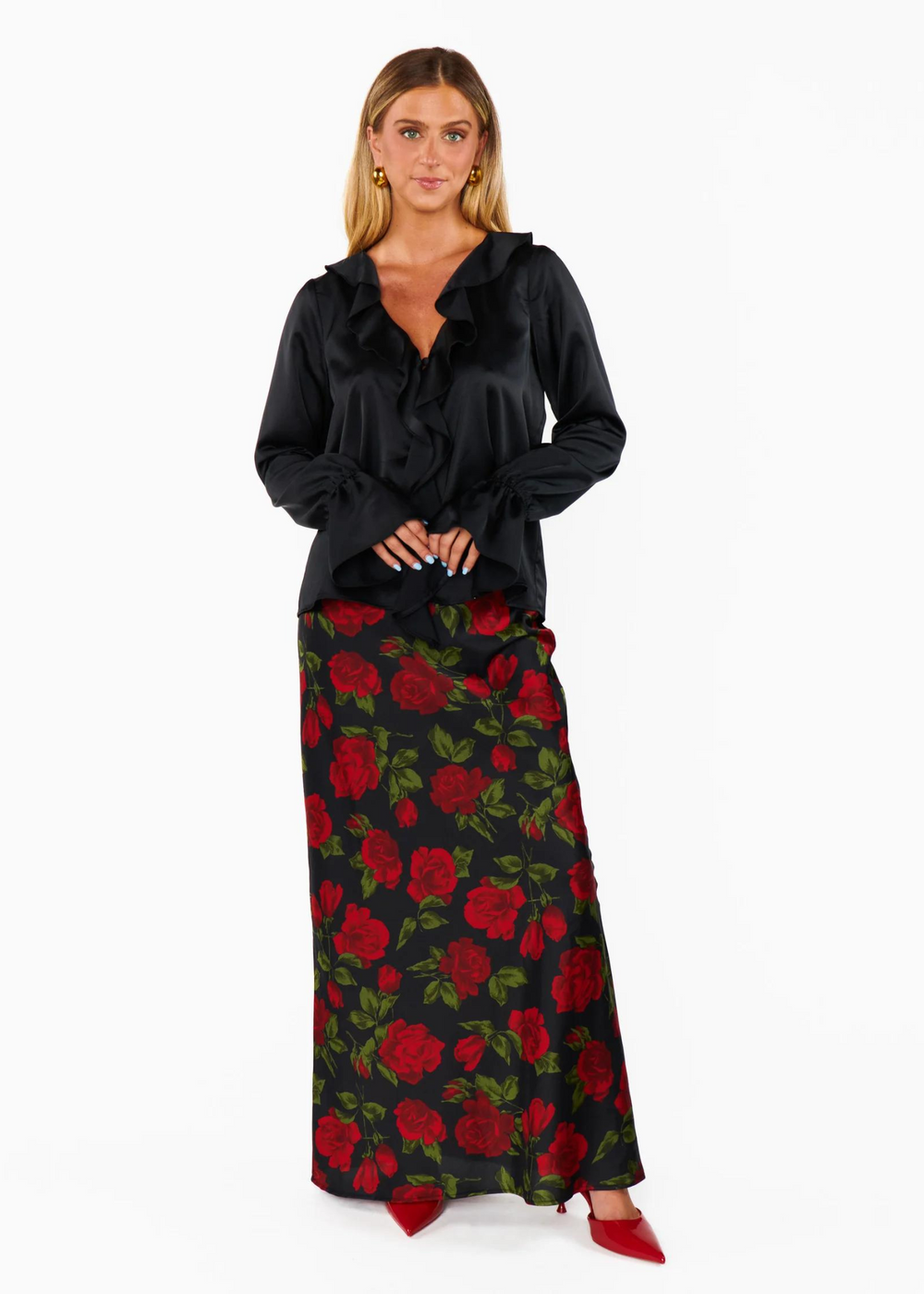 Show Me Your Mumu Maci Maxi Skirt featuring the romantic "Send Me Roses" print with bold red roses and green leaves on a black flowy silhouette.