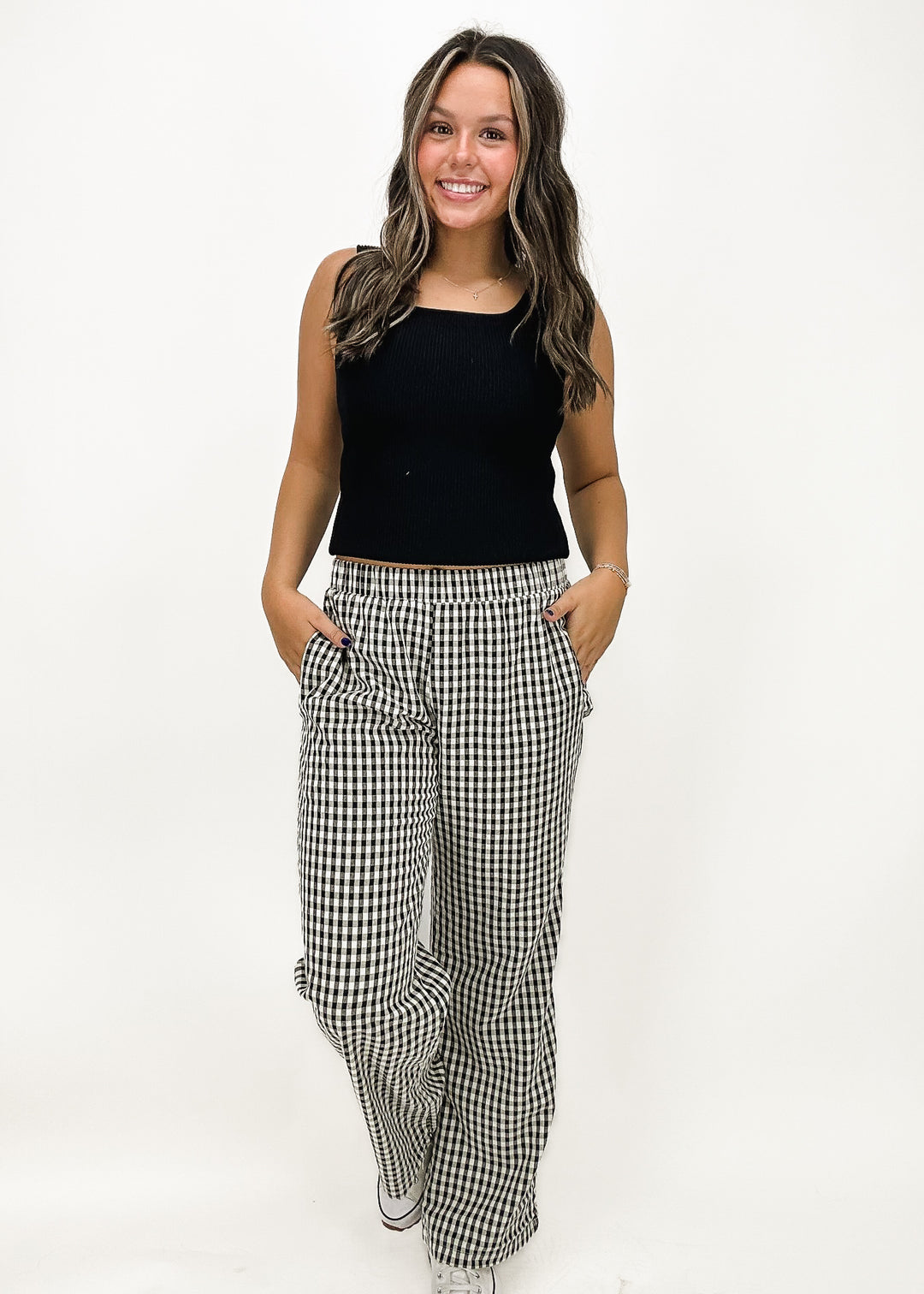 Women's black and white gingham elastic waistband wide-leg pants, featuring a relaxed fit and lightweight fabric for a comfortable yet stylish look.