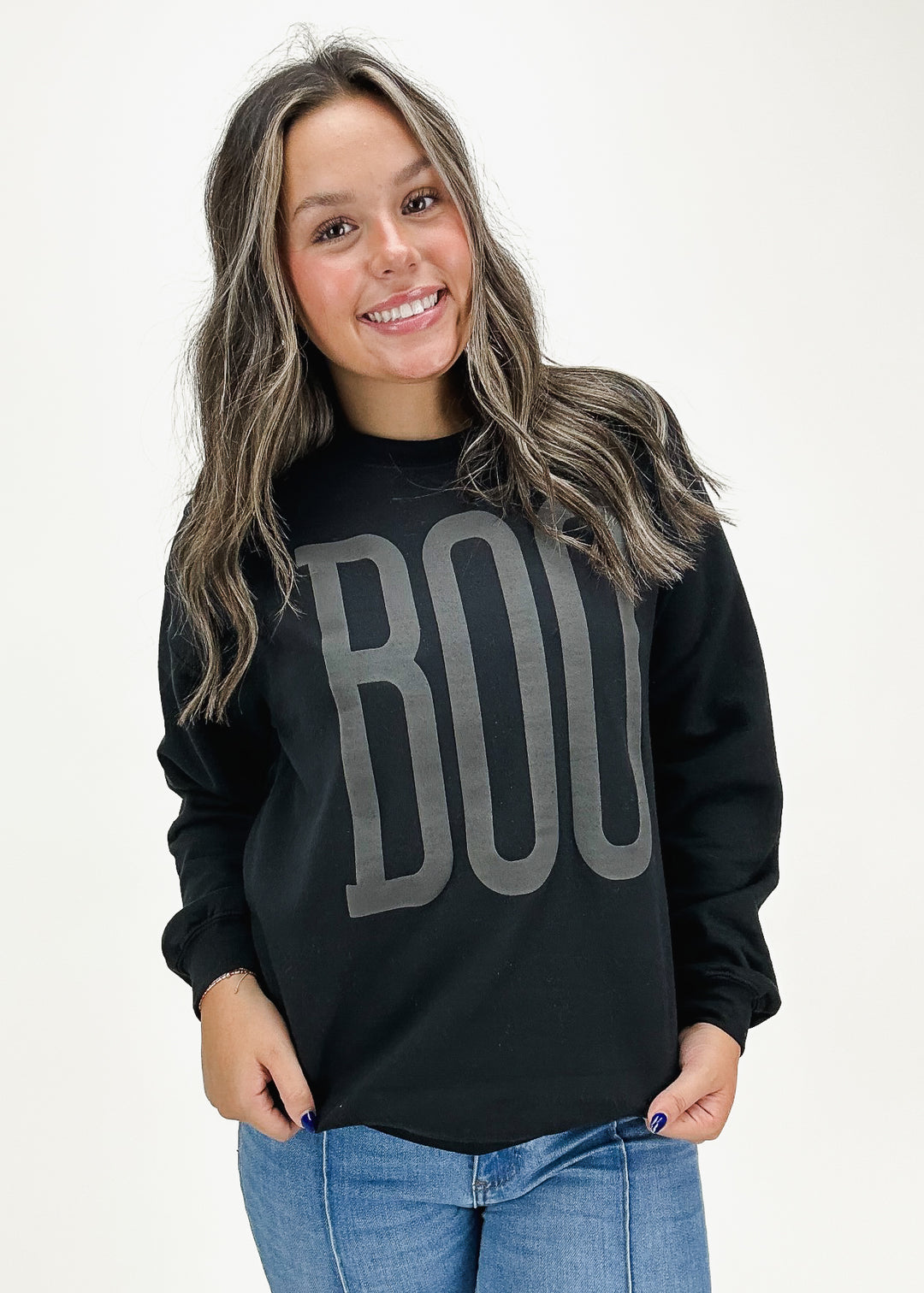 black oversized crew neck sweatshirt with charcoal "BOO" written on front