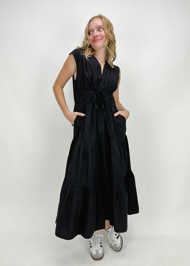 black v neck maxi dress with plunging neckline and bows on front with pockets