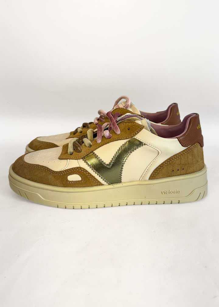 A pair of vintage Victoria brand low-top sneakers in brown, beige, and metallic olive green, featuring pink laces and a cream-colored sole.