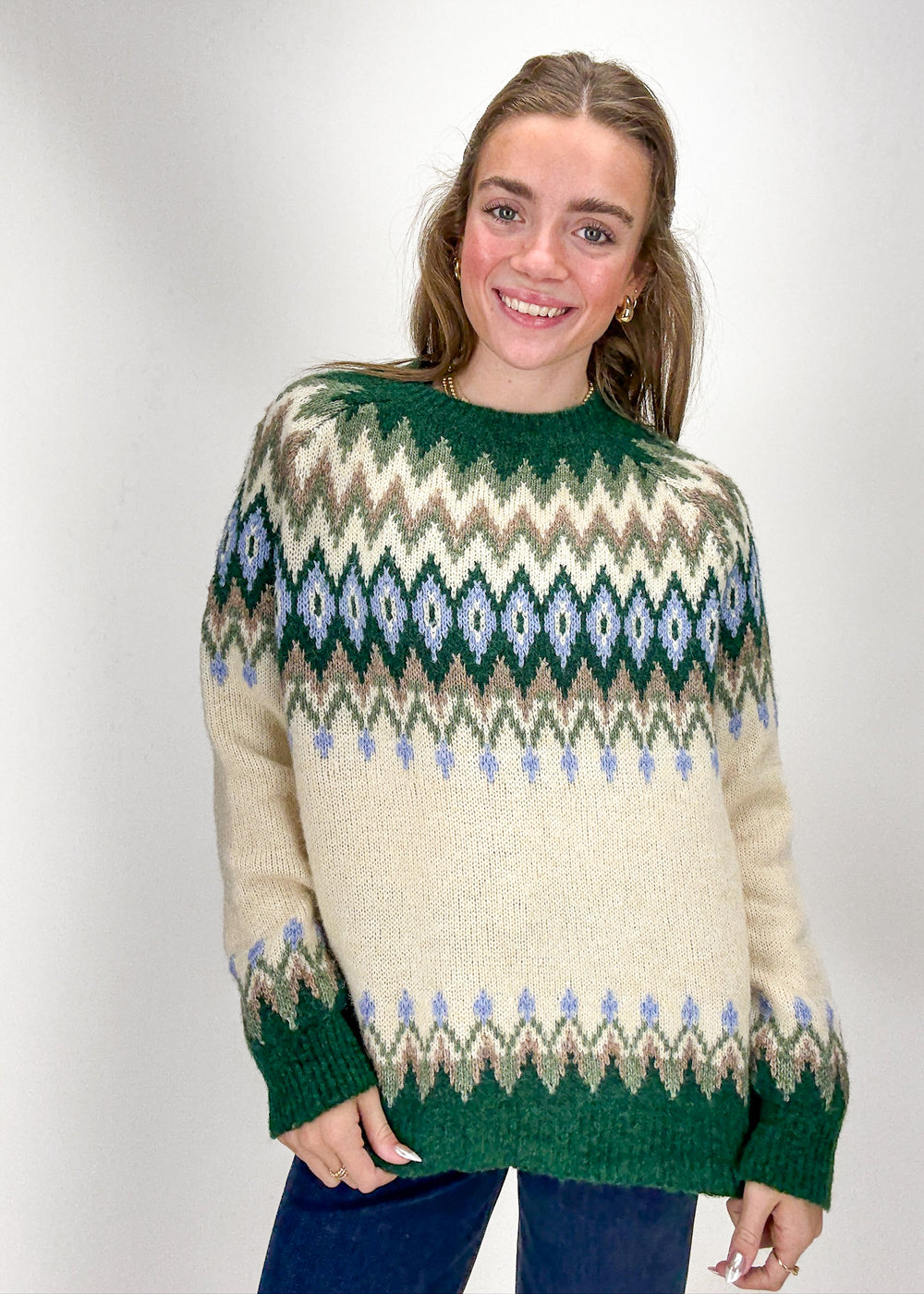 Woman wearing a patterned sweater 