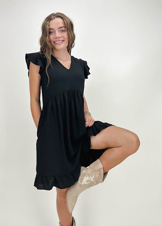 black v neck mini dress with ruffle sleeves and gathered skirt with ruffle hem