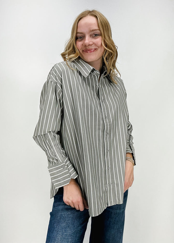 gray and white vertical stripe collared long sleeve button down shirt