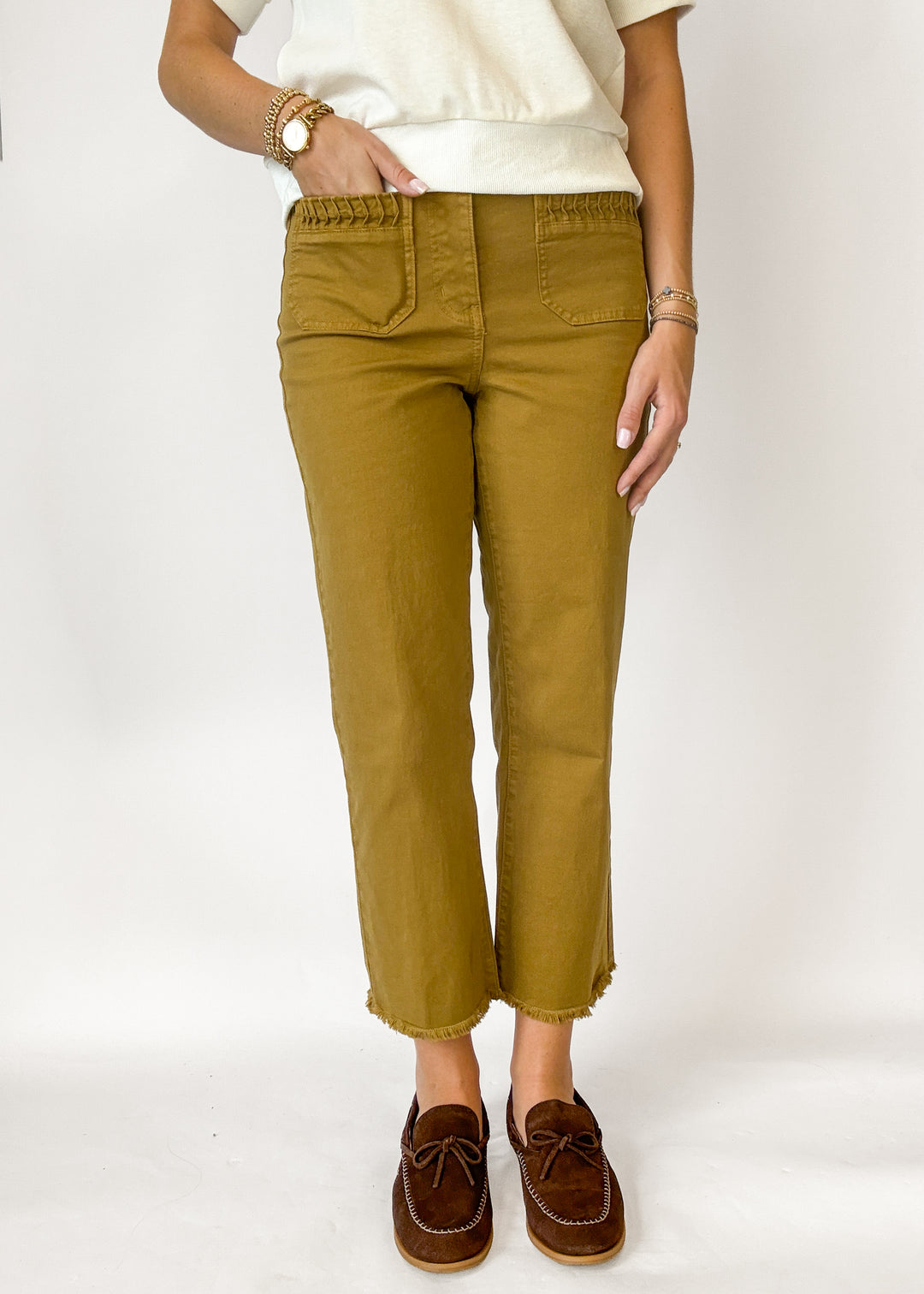 Woman wearing bronze colored wide leg cropped pants 